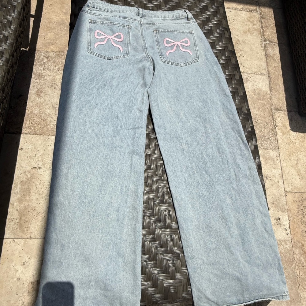 Edikted Light Blue Flare Jeans with Pink Bow Accents